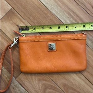 Dooney & Bourke orange leather wristlet
